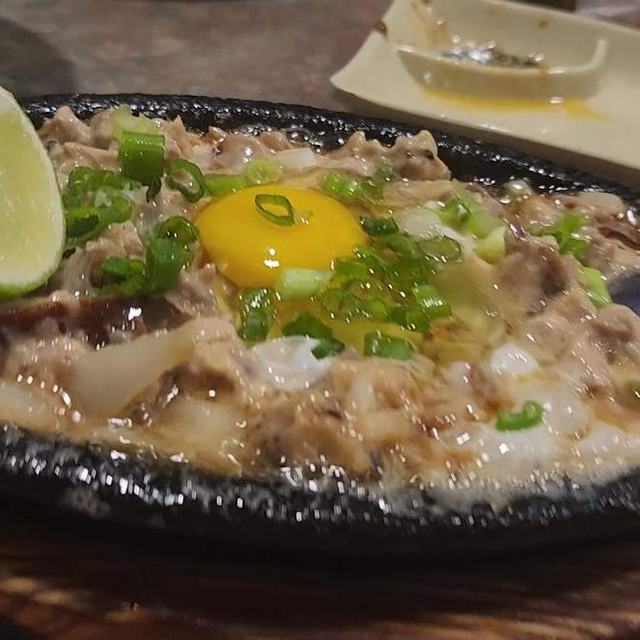 Sizzling sisig with egg